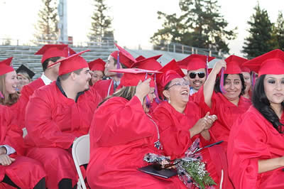 Students turn their tassels at the 2010 graduation